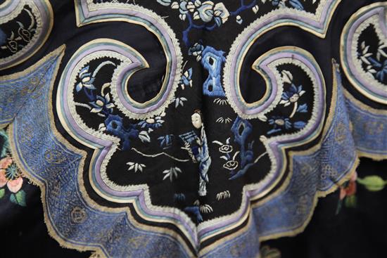 A Chinese black satin robe, 19th century, some wear